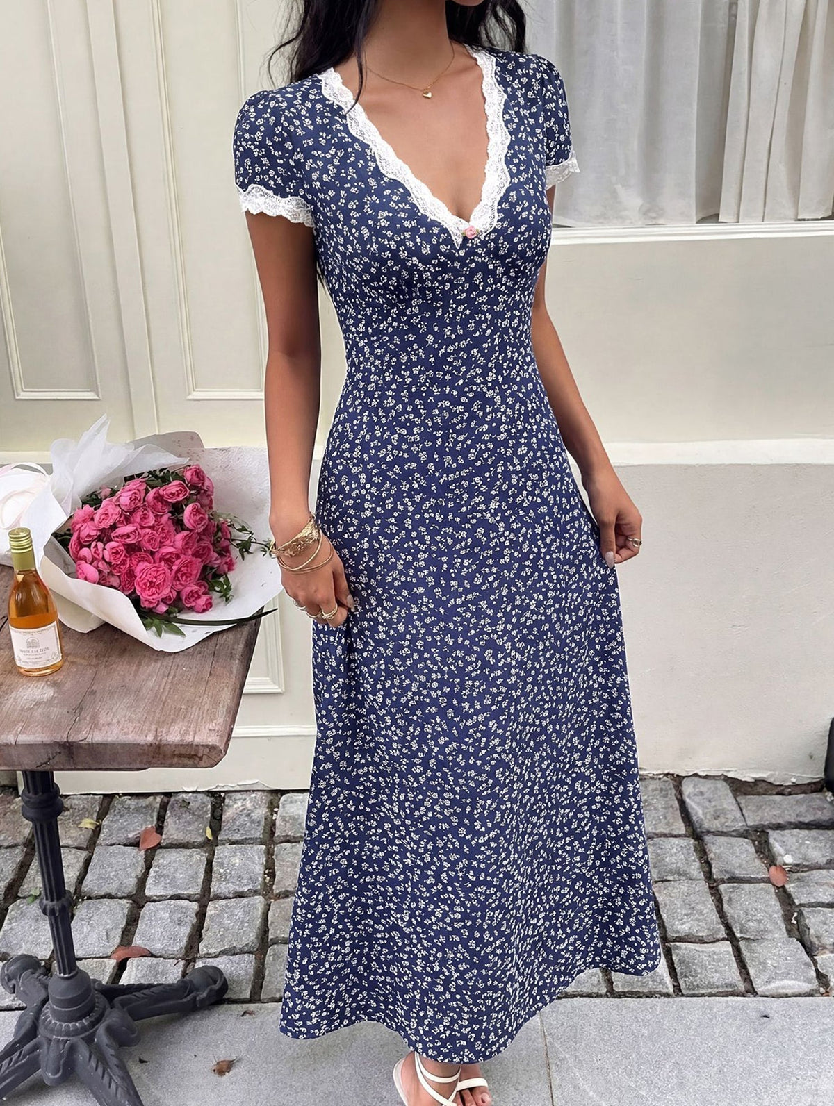 White floral lace patch V-neck maxi dress by Christine Brewer featuring delicate lace details and flowing fabric.