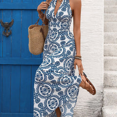 White halter print backless maxi dress by Christine Brewer, flowing fabric, sleeveless design, and elegant style.
