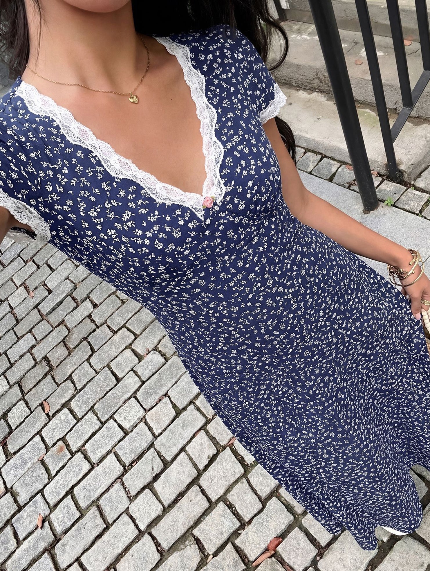 White lace patch floral V-neck maxi dress by Christine Brewer, featuring a flowing silhouette and intricate floral lace details.