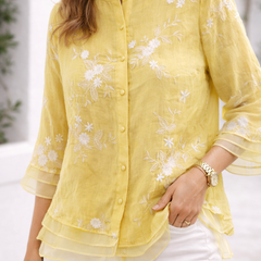 Green floral blouse for women by Christine Brewer, featuring a stylish floral pattern and lightweight fabric.