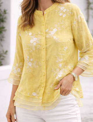 Green floral blouse for women by Christine Brewer, featuring a stylish floral pattern and lightweight fabric.