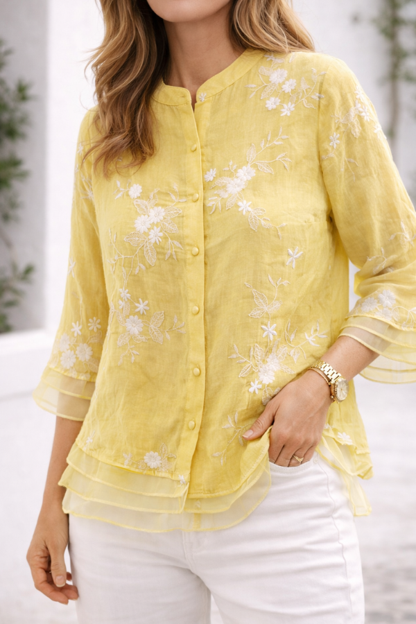 Green floral blouse for women by Christine Brewer, featuring a stylish floral pattern and lightweight fabric.