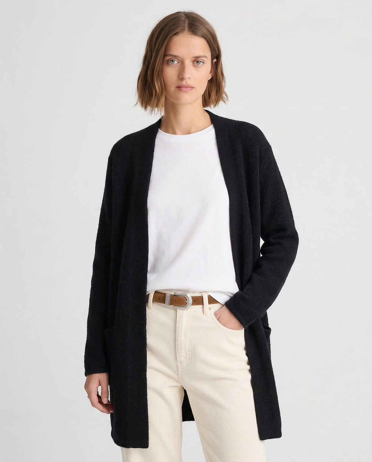 Women’s Jacqueline merino wool cardigan by Christine Brewer, featuring a cozy, fitted knit sweater in neutral colors.