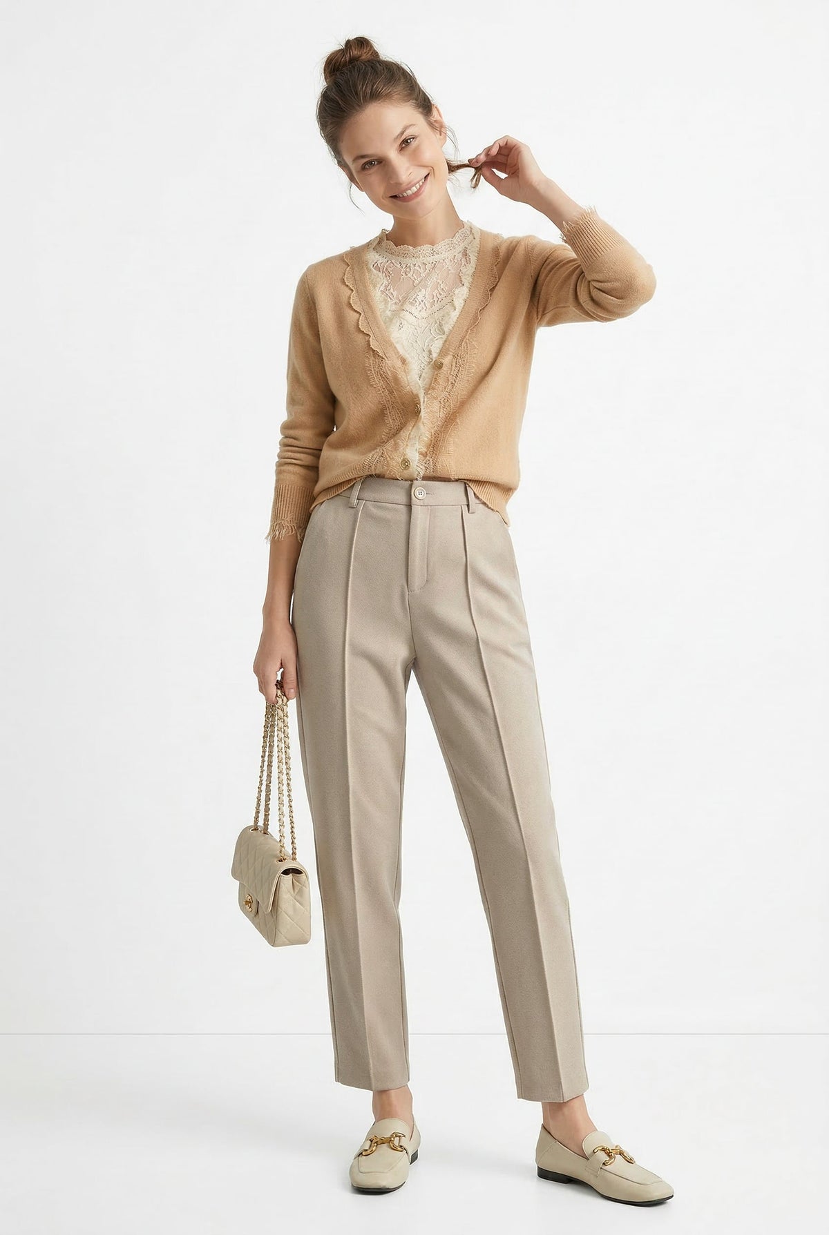 Women’s wool tapered trousers by Christine Brewer, featuring a classic fit and cozy merino wool fabric, shown in a stylish outfit.
