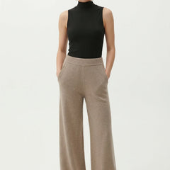 Women’s loose pull-on joggers by Christine Brewer, comfortable casual pants with a relaxed fit, shown in a stylish outfit.