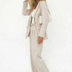White wide-leg high-waist trousers for women, styled as high-waist pants by Christine Brewer, shown on a model.