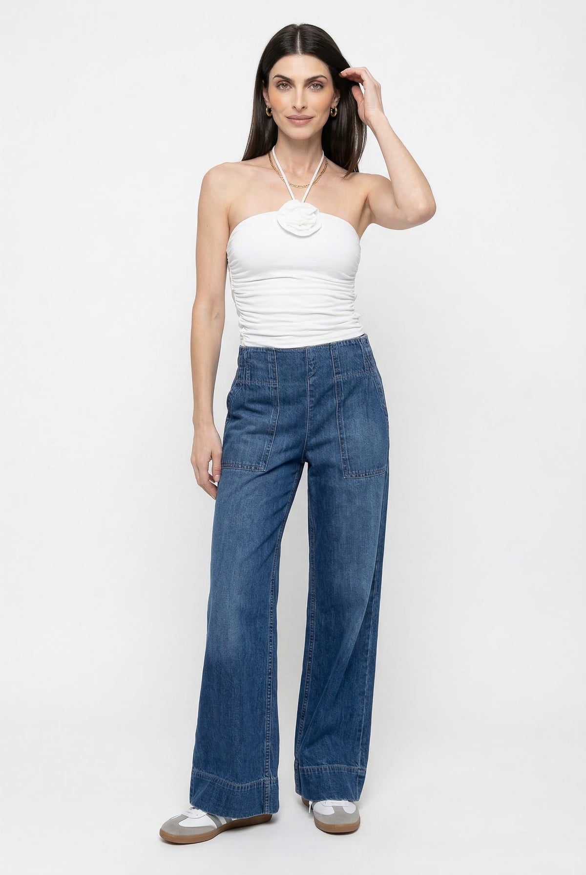 Blue denim wide-leg women's jeans from Christine Brewer, featuring a relaxed fit and casual style, shown on a model.