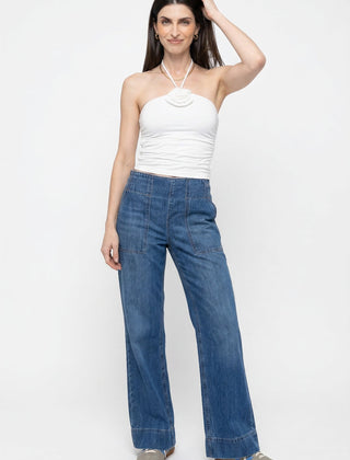 Blue denim wide-leg women's jeans by Christine Brewer, featuring a relaxed fit and casual style in the image.