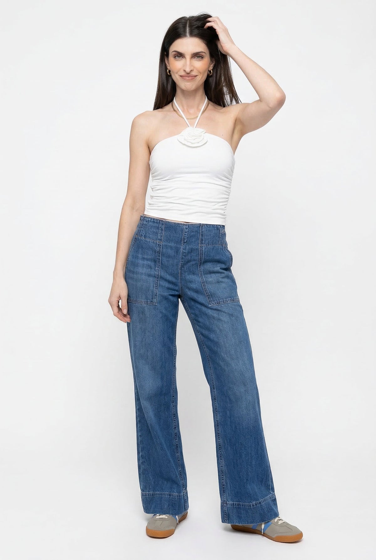 Blue denim wide-leg women's jeans by Christine Brewer, featuring a relaxed fit and casual style in the image.