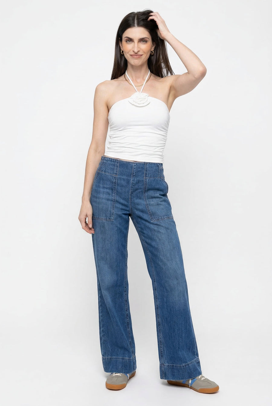 Blue denim wide-leg women's jeans by Christine Brewer, featuring a relaxed fit and casual style in the image.