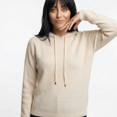 Cream-colored Claudia cashmere hoodie for women by Christine Brewer, shown in a cozy, relaxed fit.