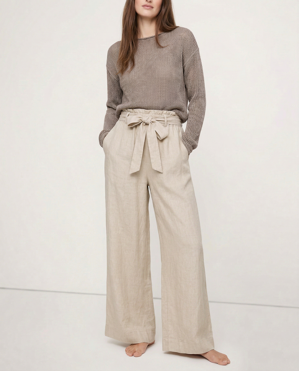Women’s linen wide-leg trousers by Christine Brewer featuring loose fit, pull-on style, and lightweight, breathable fabric.