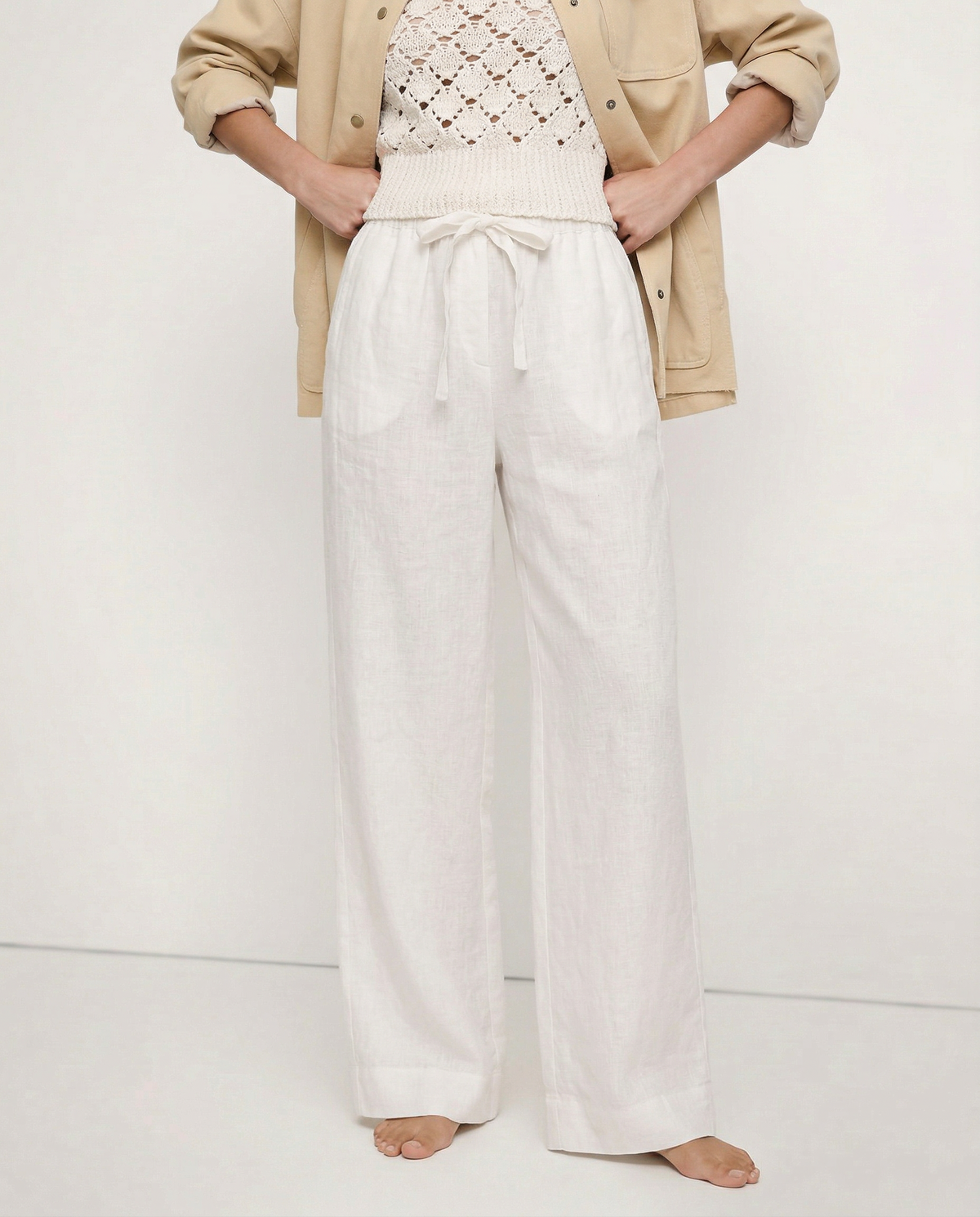 Linen wide-leg trousers for women by Christine Brewer, loose pull-on design, showing soft linen fabric and relaxed fit.