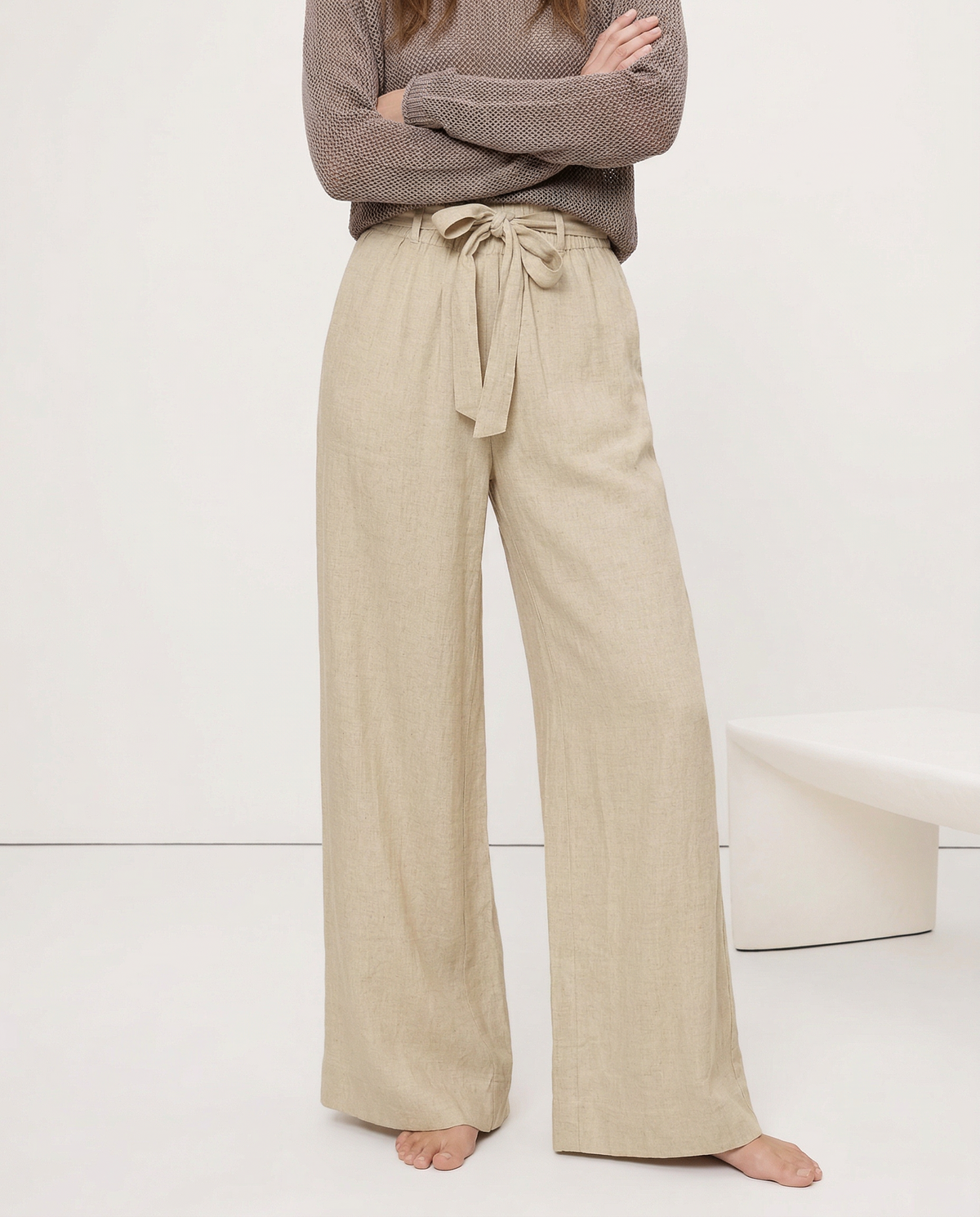 Women’s linen wide-leg trousers by Christine Brewer featuring loose fit, pull-on style, and visible lightweight fabric texture.