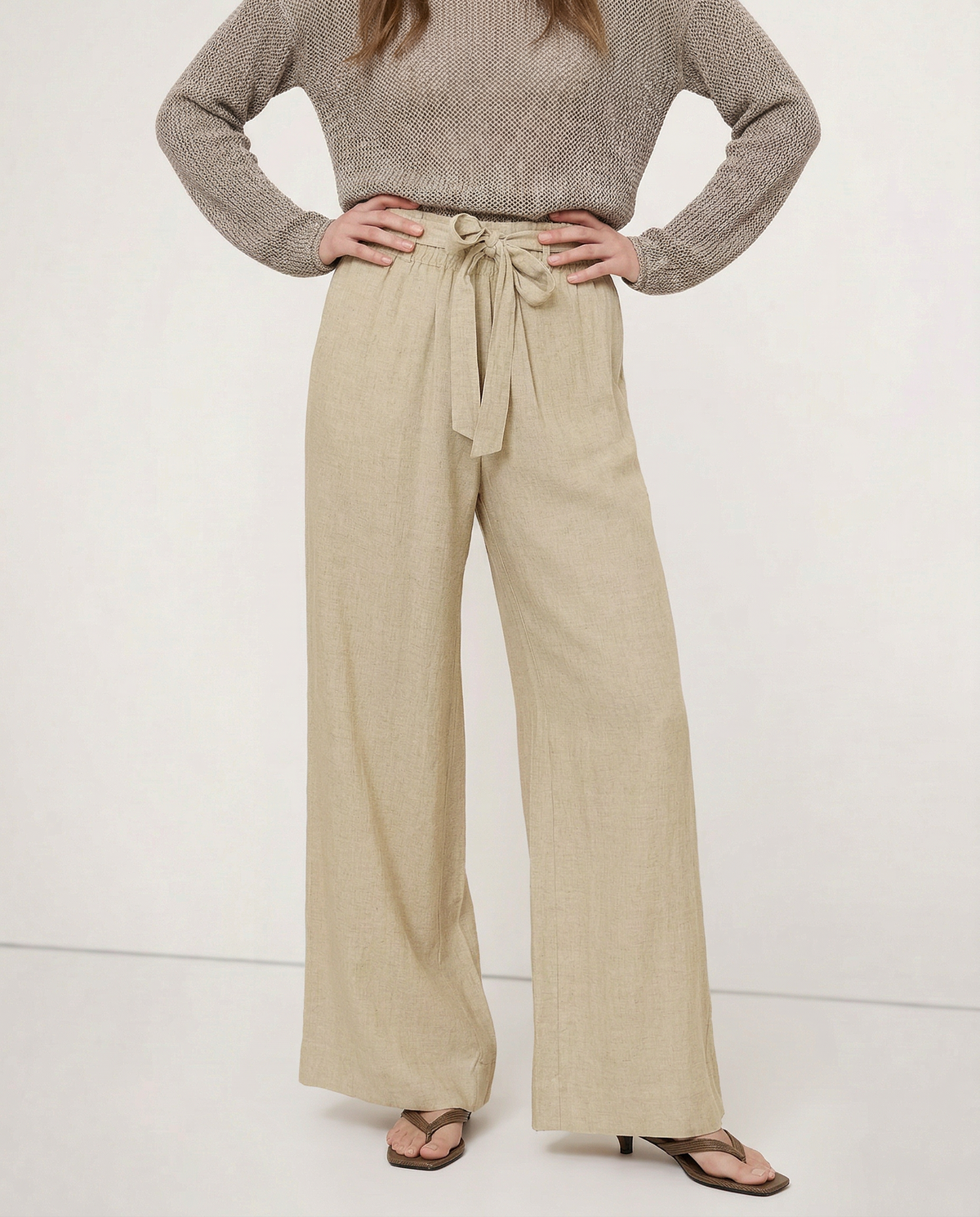 Women’s linen wide-leg trousers by Christine Brewer featuring loose fit, pull-on style, and visible high-quality linen fabric.