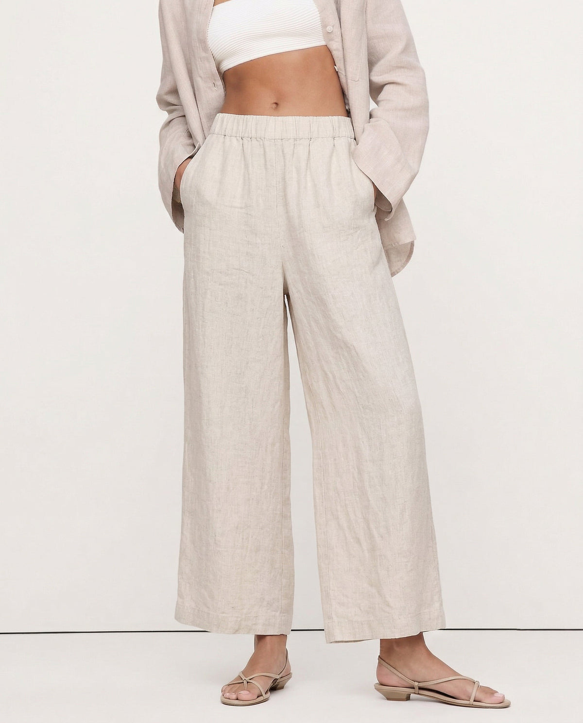 Linen cropped wide-leg drawstring trousers for women by Christine Brewer, showing soft, high-quality linen fabric and relaxed fit.