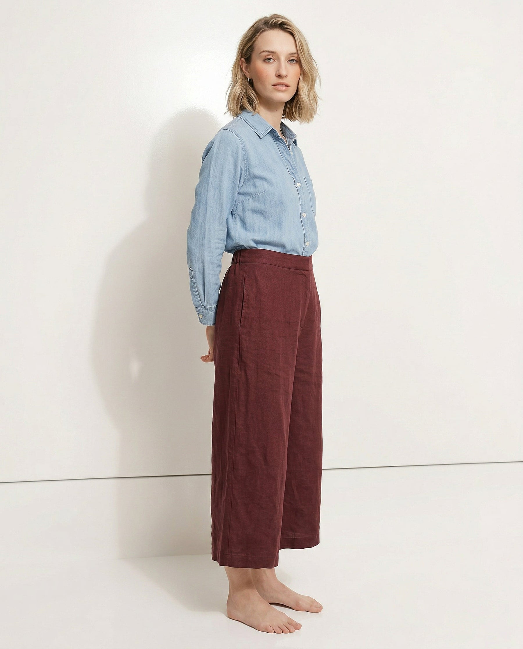 Linen cropped wide-leg drawstring trousers for women by Christine Brewer, showing the fabric's quality and relaxed fit.
