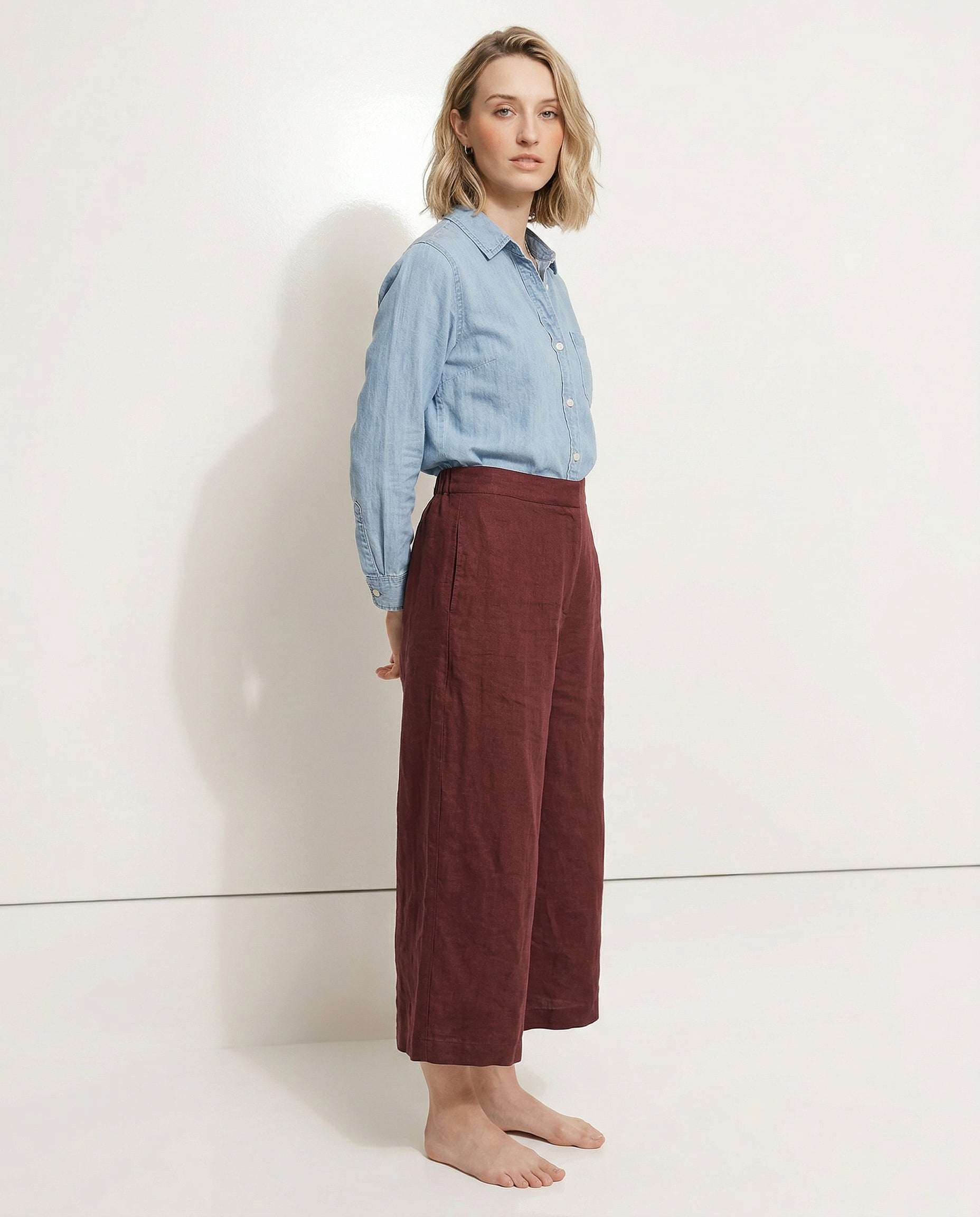 Linen cropped wide-leg drawstring trousers for women by Christine Brewer, showing the fabric's quality and relaxed fit.