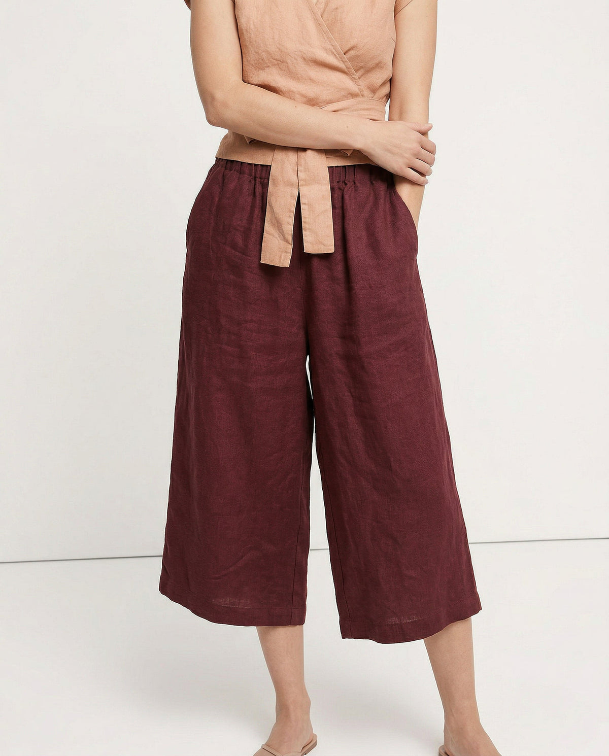 Linen cropped wide-leg drawstring trousers for women by Christine Brewer, showing fabric quality and relaxed fit.