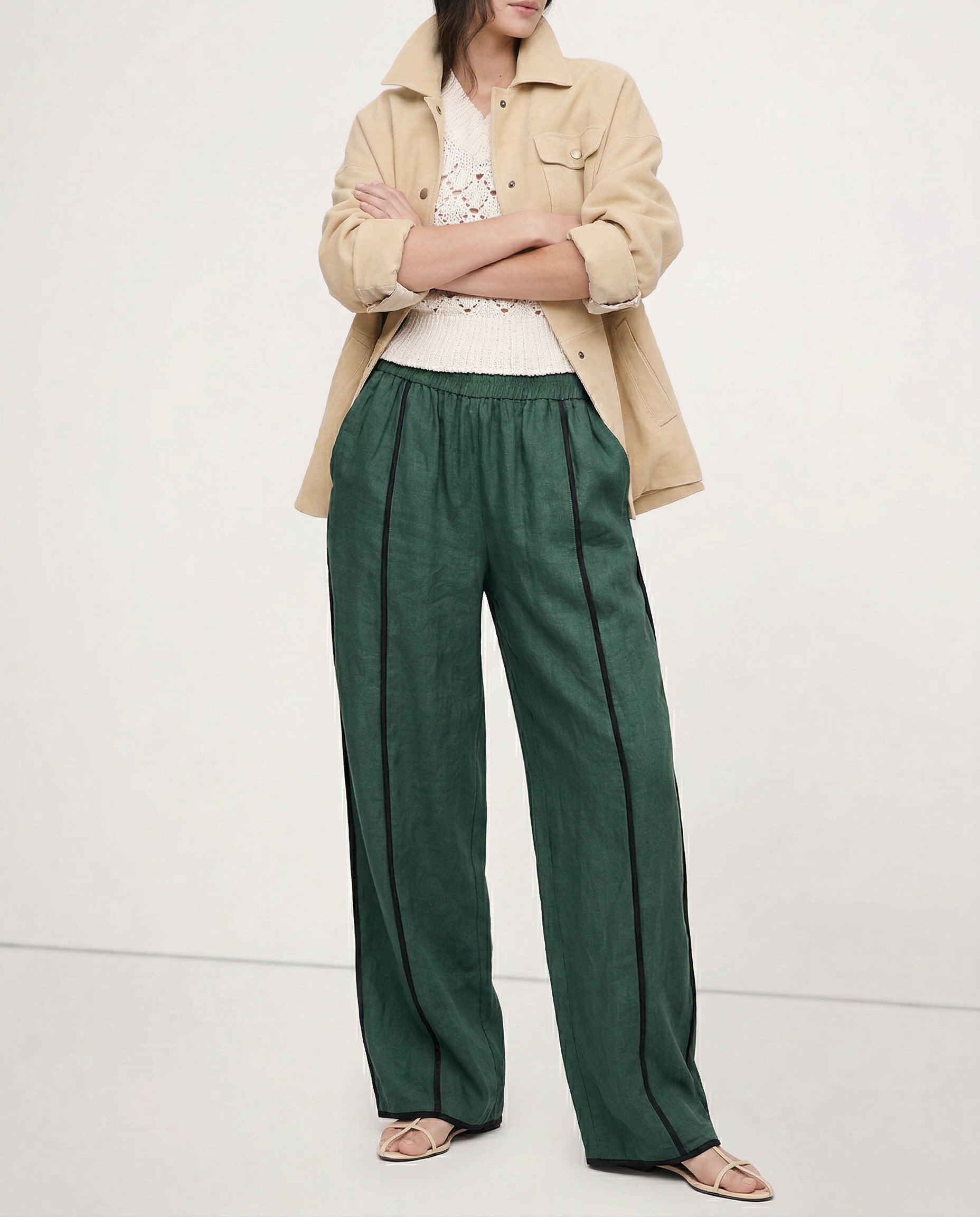 Women’s linen wide-leg elastic waist trousers by Christine Brewer, featuring a loose fit and high-quality, realistic fabric texture.