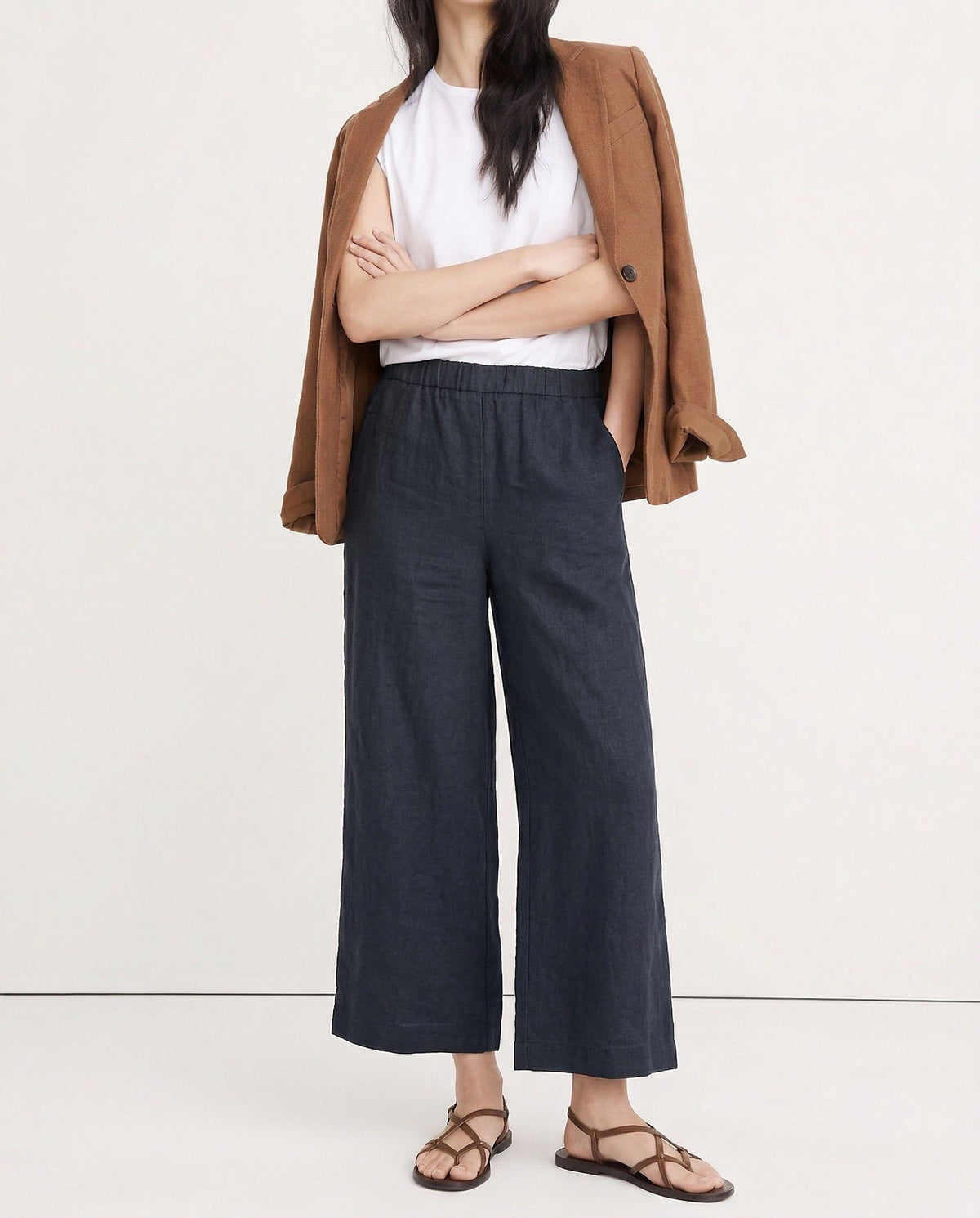 Linen cropped wide-leg drawstring trousers for women by Christine Brewer, showing soft linen fabric and relaxed fit.