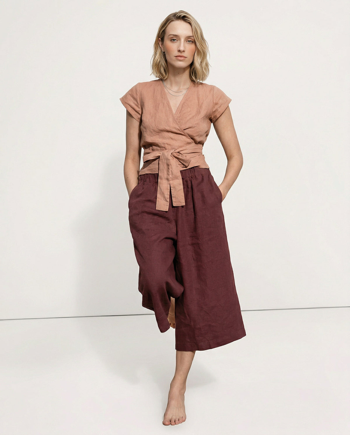Linen cropped wide-leg drawstring trousers for women, featuring a relaxed fit and high-quality linen fabric, by Christine Brewer.