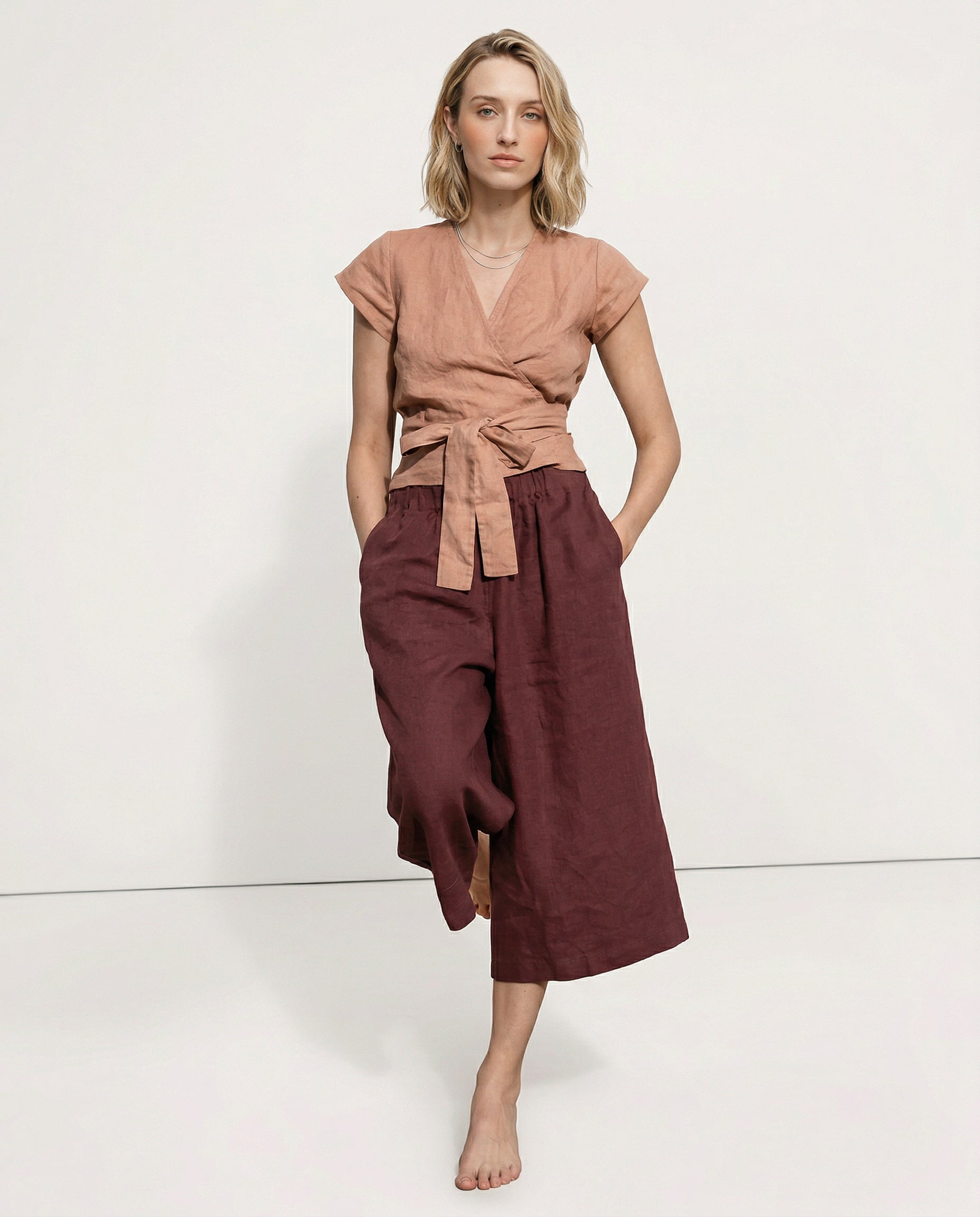 Linen cropped wide-leg drawstring trousers for women, featuring a relaxed fit and high-quality linen fabric, by Christine Brewer.