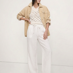 Light beige linen wide-leg women's trousers by Christine Brewer, showcasing soft fabric and relaxed pull-on style.