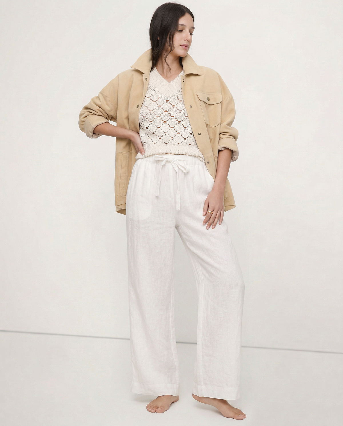 Light beige linen wide-leg women's trousers by Christine Brewer, showcasing soft fabric and relaxed pull-on style.