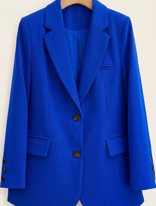 Tailored women's blazer from Christine Brewer featuring a classic fit, lapel collar, and structured design.