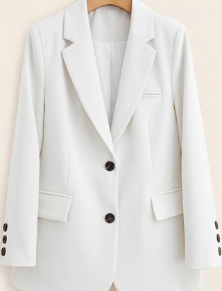 Tailored women's blazer by Christine Brewer featuring a classic fit and structured design, shown in a neutral color.