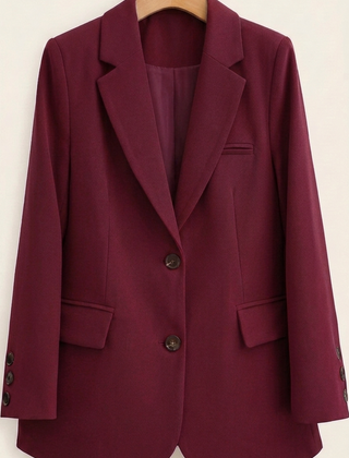 Tailored women's Alice blazer by Christine Brewer, featuring a fitted design in classic fabric, shown on a hanger.