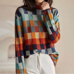 Christine Brewer Cora cozy loose fit sweater, tailored and stylish, with a soft knit texture and relaxed fit in neutral color.