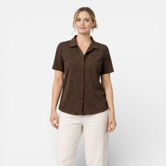 Women's short sleeve button-up shirt by Christine Brewer, classic fit, featuring a collar and front buttons, in a versatile style.
