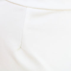 White batwing-sleeve waist-cinching dress for women by Christine Brewer, shown with flowing fabric and stylish silhouette.