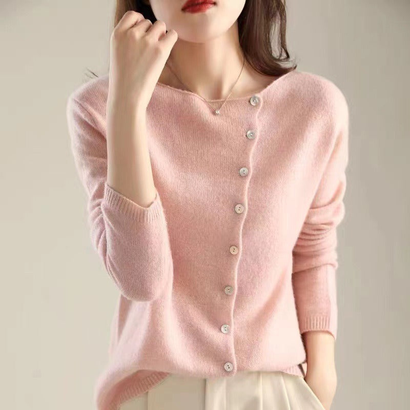 Woman wearing the Dorothy knit sweater for women by Christine Brewer, featuring a cozy, stylish design in the image.