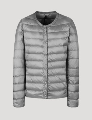 Light gray Lily quilted puffer jacket for women by Christine Brewer, shown with a lightweight, padded design and cozy fit.