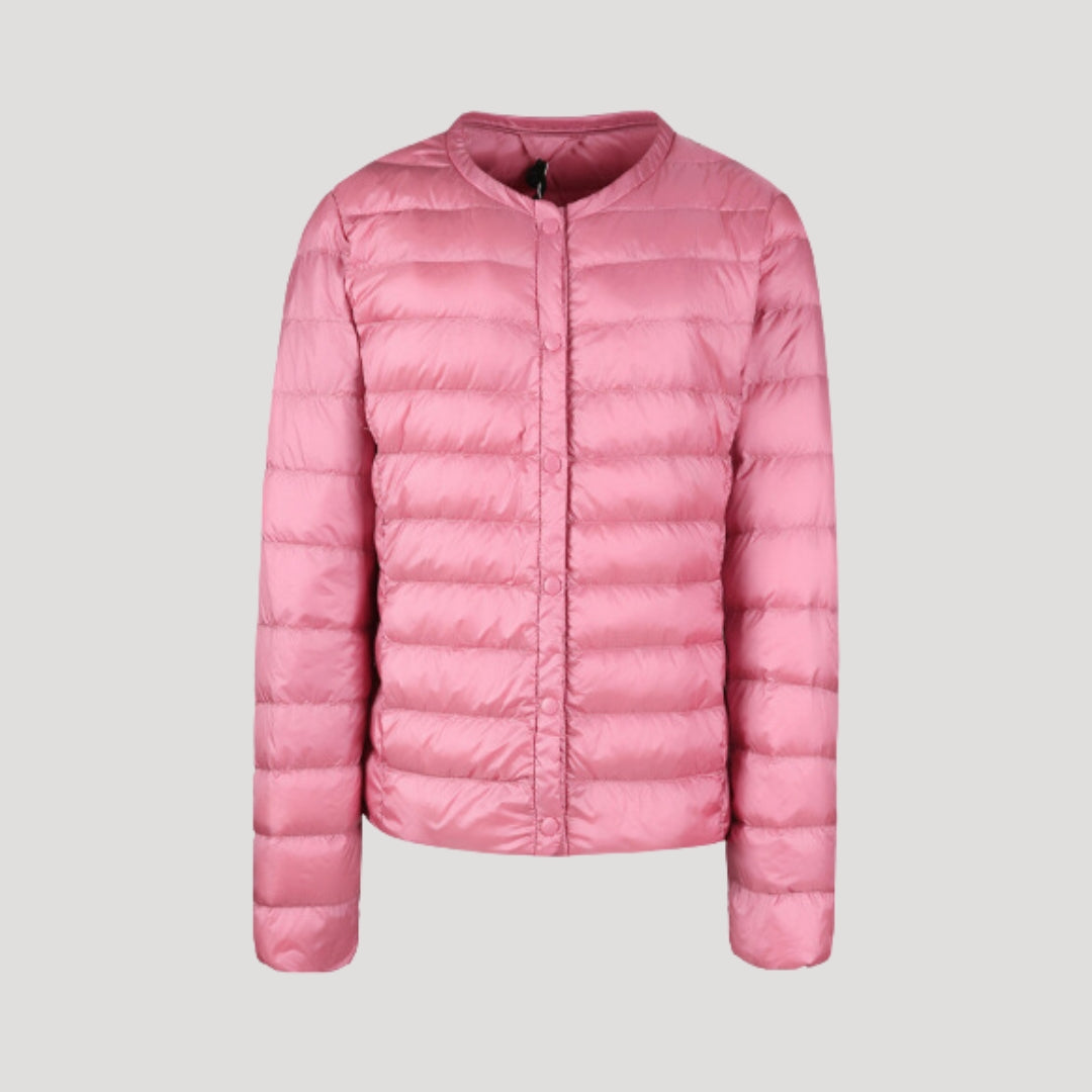 Light pink Ingrid quilted puffer jacket for women by Christine Brewer, featuring lightweight, quilted design and cozy winter style.