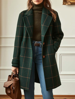 Women's retro plaid tweed coat with lapel collar by Christine Brewer, shown hanging on a wooden hanger.