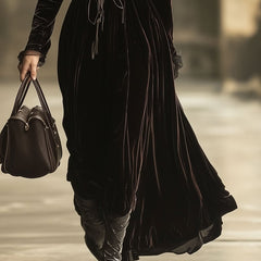 Velvet V-neck maxi dress by Christine Brewer featuring a flowing silhouette and elegant evening dress design.