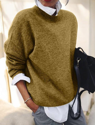 Beige knit sweater for women by Christine Brewer, featuring a cozy, textured design with a high neckline and long sleeves.
