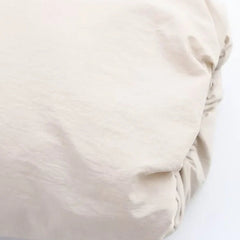 Kira hooded puffer jacket for women by Christine Brewer, featuring a warm quilted design and adjustable hood.