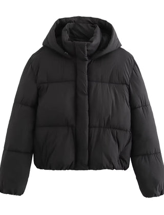 Black Christene Brewer Grace hooded puffer jacket for women, showcasing its quilted design and cozy hood.