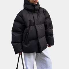 Lightly quilted Sienna long hooded puffer jacket for women by Christine Brewer, shown in a stylish, insulated design.