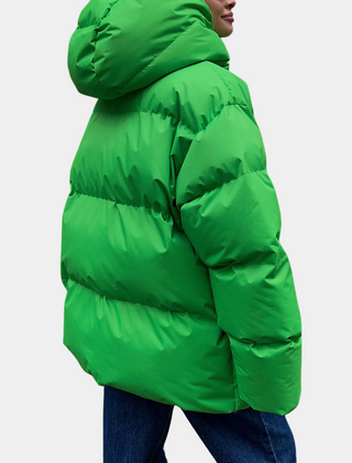 Lightly quilted Sienna long hooded puffer jacket for women by Christine Brewer, shown in a stylish, lightweight design.