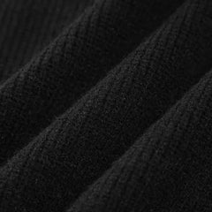 Black ribbed wool mock neck oversized sweater for women by Christine Brewer, perfect for autumn casual wear.