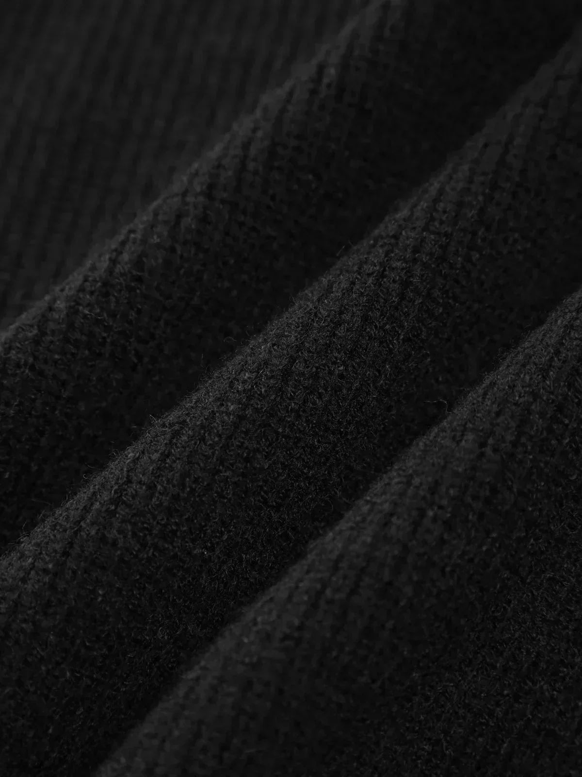 Black ribbed wool mock neck oversized sweater for women by Christine Brewer, perfect for autumn casual wear.