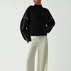 Black Valentina oversized wool sweater for women with ribbed knit and mock neck, featuring whipstitch details, by Christine Brewer.