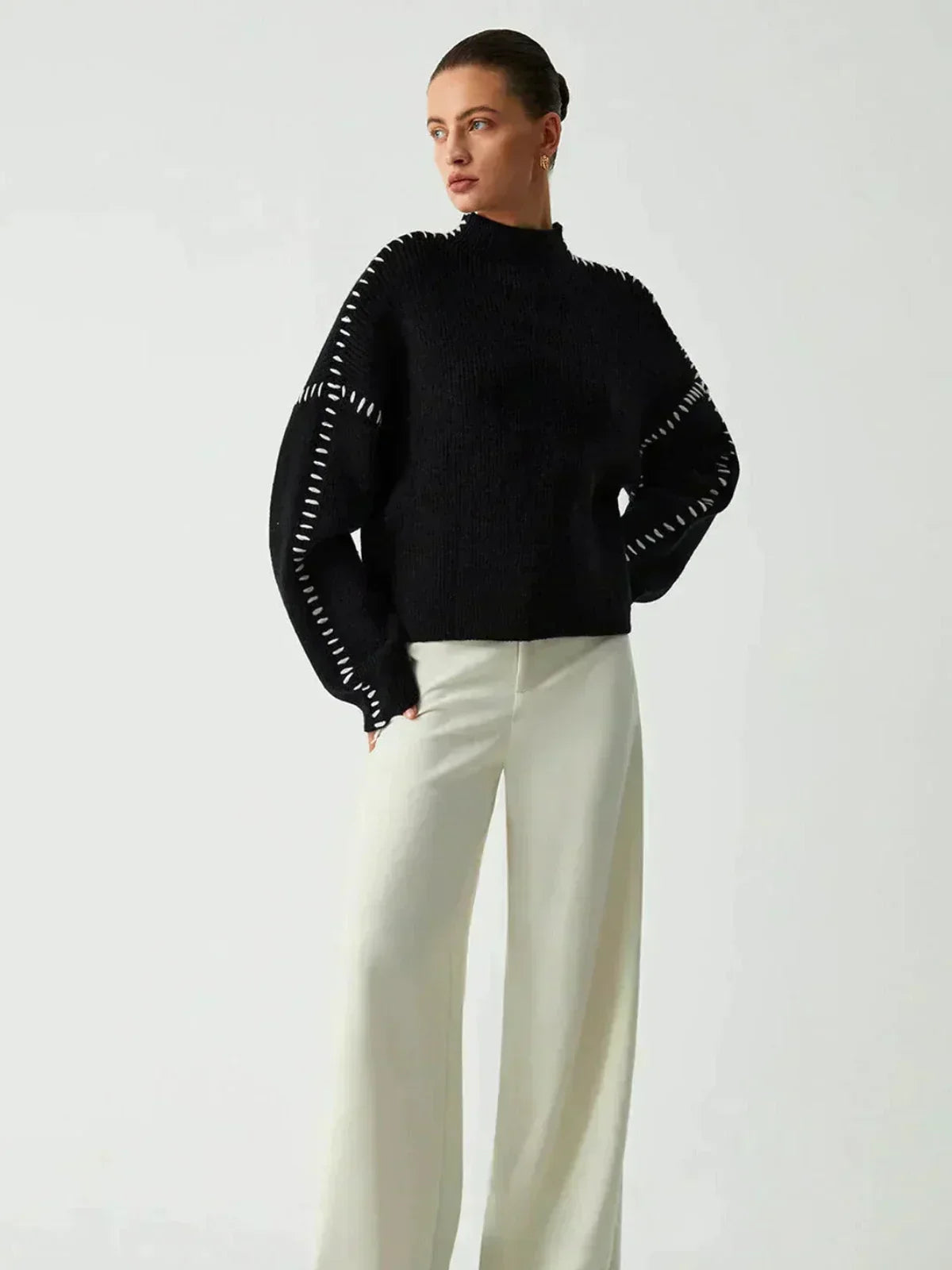 Black Valentina oversized wool sweater for women with ribbed knit and mock neck, featuring whipstitch details, by Christine Brewer.