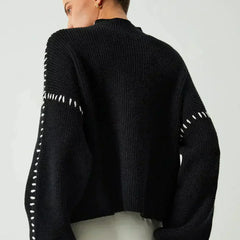 Black oversized ribbed wool mock neck sweater for women by Christine Brewer, perfect for autumn, featuring whipstitch details.